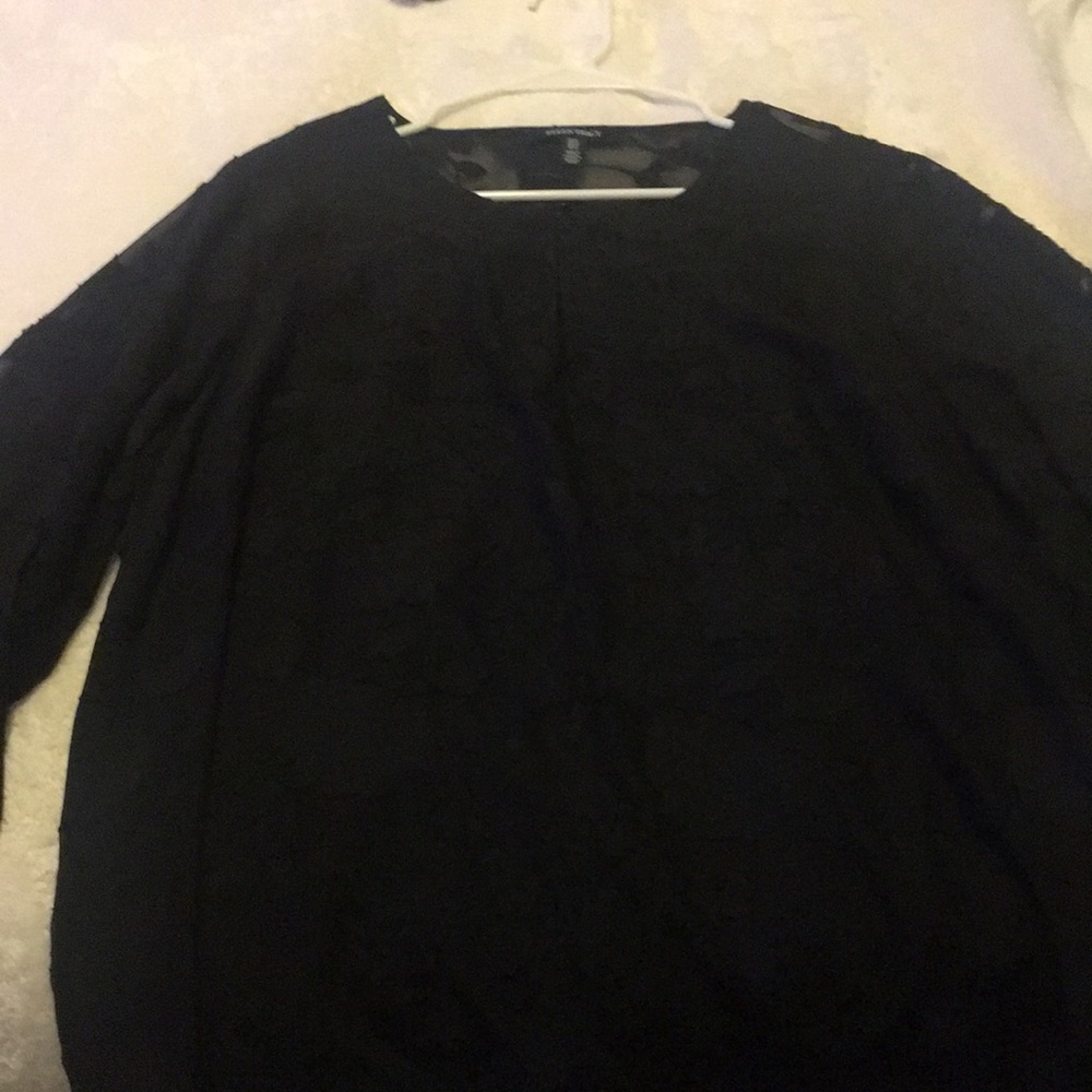 A black blouse with designs